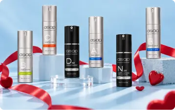ASAP Skincare serum bottles arranged with a red Valentine’s ribbon